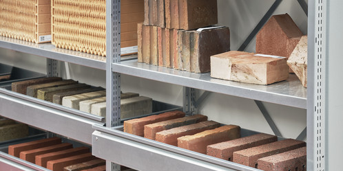 Various stones sorted in a metal shelf